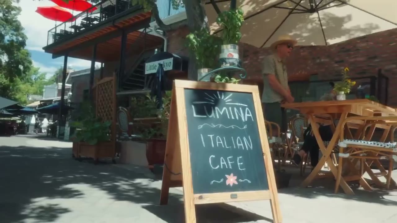 The patio outside Lumina, with diners seated under umbrellas